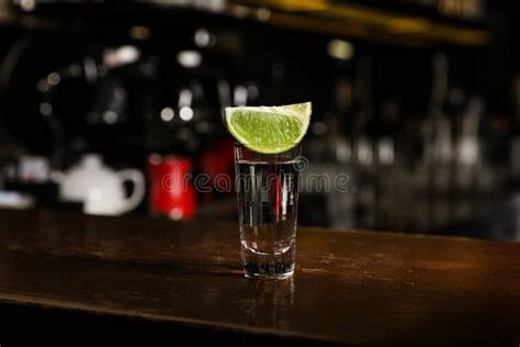 Mexican Tequila Shot With Lime Slice On Bar Counter Stock Photo Image