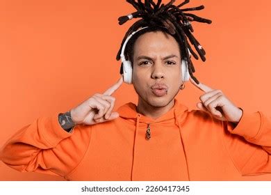 Multiracial Man Dreadlocks Pointing Wireless Headphones Stock Photo