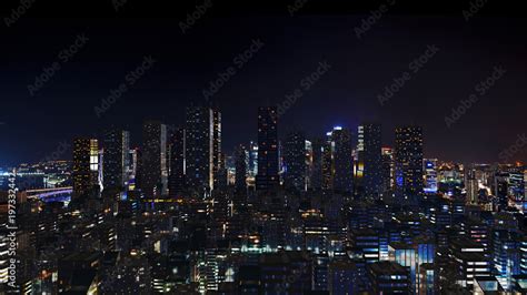 Futuristic city skyline at night time. Stock Photo | Adobe Stock