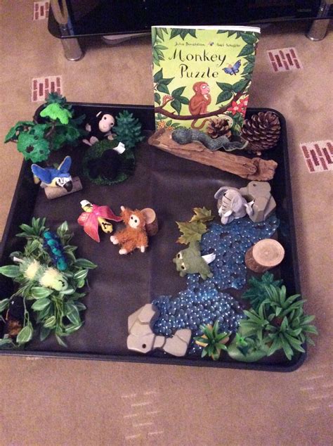 Monkey puzzle story tray | Monkey puzzle book, Book themed activities, Book baskets