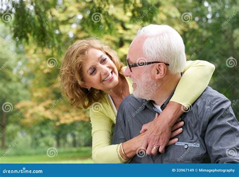 Happy Older Couple Smiling And Looking At Each Other Outdoors Stock Image Image Of Happiness