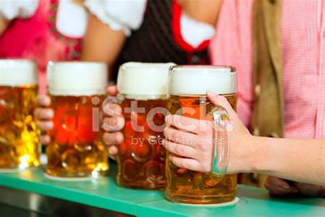 People Drinking Beer In Bavarian Pub Stock Photo | Royalty-Free ...