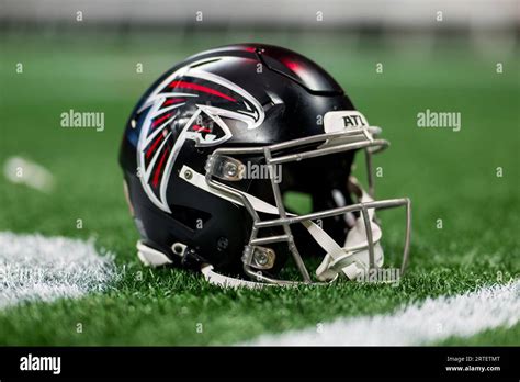 An Atlanta Falcons Helmet Sits On The Field After An Nfl Football Game