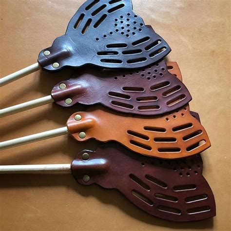 Four Spatulas Are Lined Up On A Table