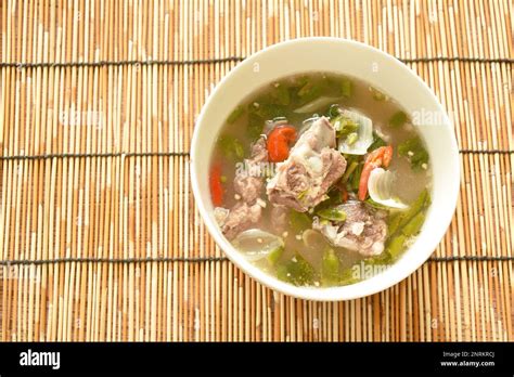 Hot And Spicy Pork Bone With Tamarind And Thai Herbs Soup On Bowl Stock Photo Alamy