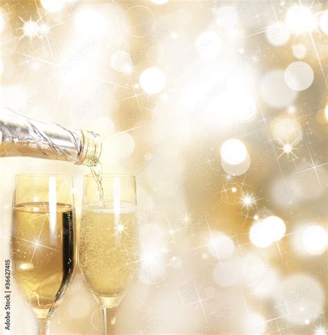 Champagne glasses with golden background Stock Photo | Adobe Stock