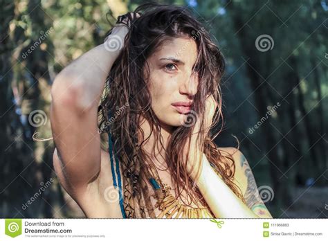 Beautiful Pagan Woman Looking At The Sunrise In The Forest Stock Image