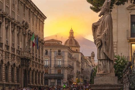 View Of Piazza Duomo And Mount Etna In The Background At Sunset