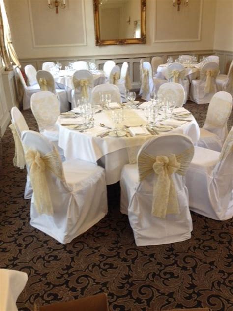 Champagne Flocked Organza Sashes On White Chair Covers At The Bridge