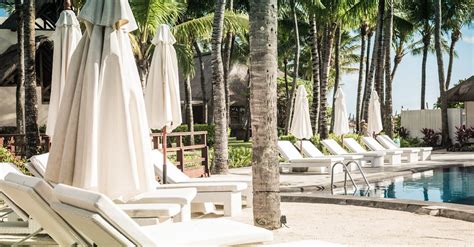 Sun Loungers at the Poolside of a Beach Resort · Free Stock Photo