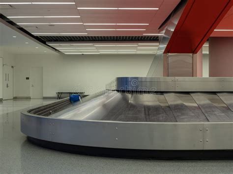 Luggage Sitting On Baggage Claim Carousel In Airport Stock Image