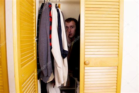 A Man Hiding In The Closet — Stock Photo © Yganko 42354363