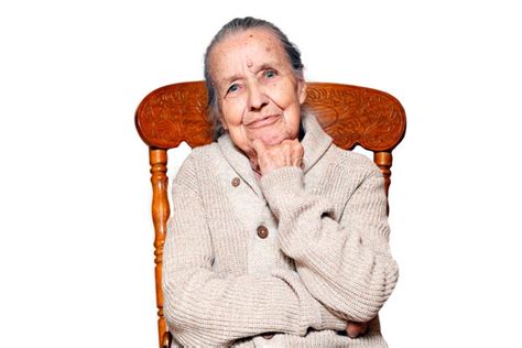 Portrait Of Gray Haired Elderly Woman Grandmother Sitting On Vintage