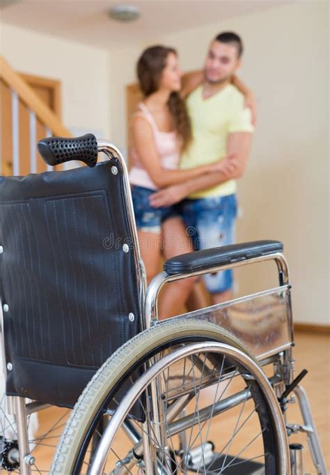 Man Helping His Disabled Wife Stock Image Image Of Indoor Couple