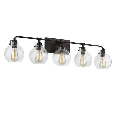 Features Clear Seeded Glass Shades That Subtly Diffuse The Lamping