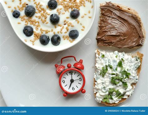 Breakfast With Yogurt, Cheese And Chocolate On White Table Stock Images ...