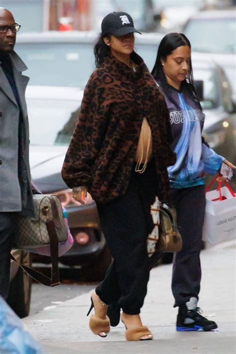 Rihanna – Shows her baby bump in a leopard coat as she returns to New York | GotCeleb