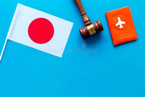 Visa To Japan Concept Japanese Flag Near Passport And Judge Hammer On Blue Background Top Down