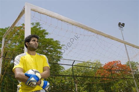 Photo Of A Goalkeeper Standing By The Goal Post Picture And Hd Photos