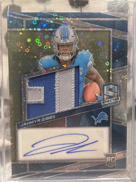 Jahmyr Gibbs 2023 Spectra 212 Rookie Patch Auto Neon Blue 50 Price