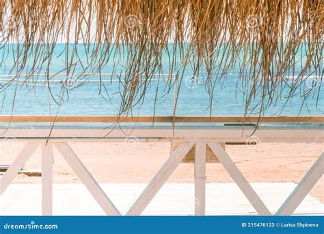 Massage Huts With Thatched Roof On Sand Beach Along Seaside Luxury