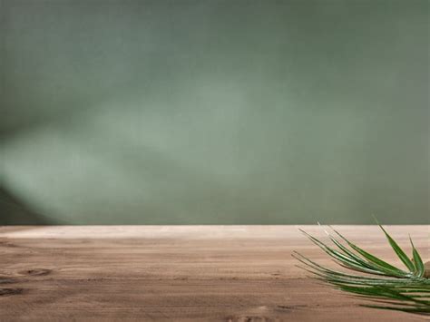 Premium Photo | Wooden table top on green wall background