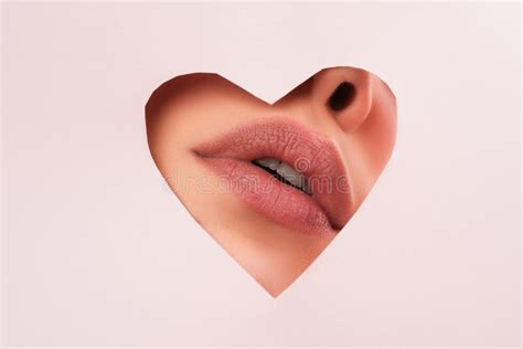 Lipscare Nude Makeup Woman Lip Through Hole In Paper Copy Space For Advertising Fashion