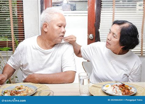 Asian Elderly Couples Dining Together Take Care Of Each Other Stock