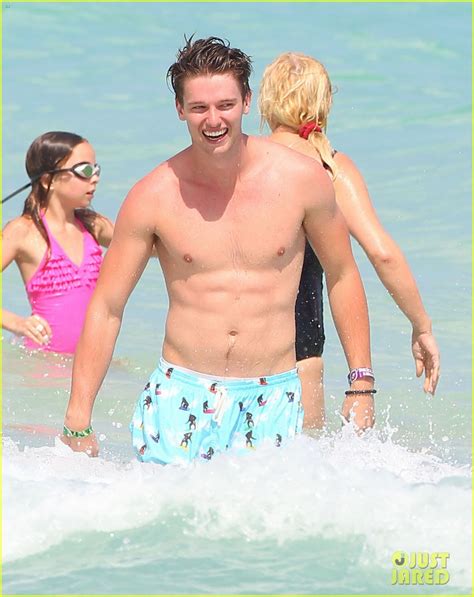 Patrick Schwarzenegger Shirtless Beach Football Photo