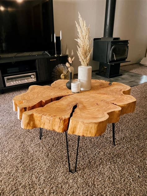 A Coffee Table Made Out Of Wood With Hairpin Legs On Carpeted Flooring