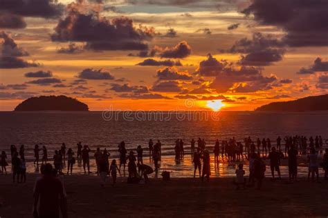 Beautiful Sunset With Silhouette Tourist At Tanjung Aru Beach Kota