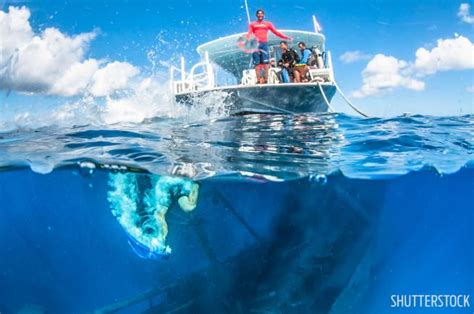 History Of Grand Cayman's Kittiwake Shipwreck | Scuba Diving