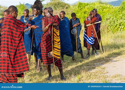 Group Of Massai People Participating A Traditional Dance With High