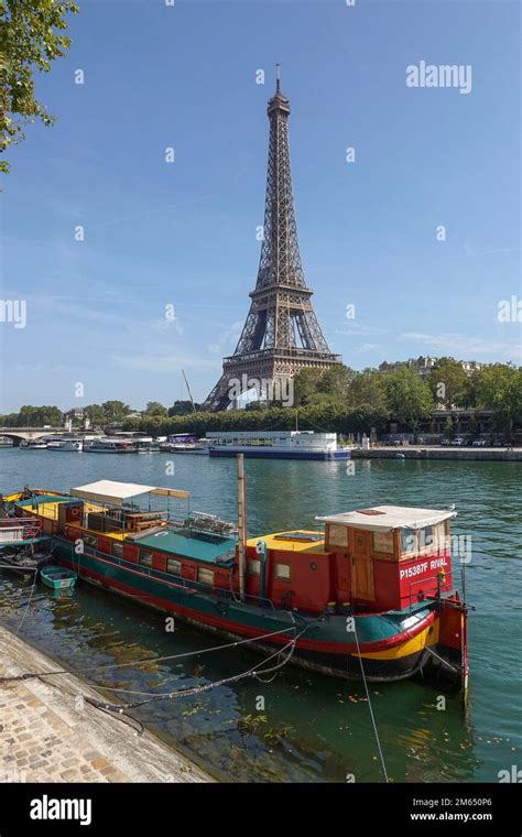 France, Paris, Boats anchored on the Seine river and view on Eiffel ...