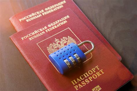 Two Russian Passports And Lock On Wood Background Toned Stock Image