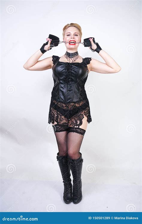 Cryel Beautiful Bdsm Mistress With Short Blonde Hair Wearing Black