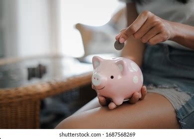 Happy Female Hand Putting Money Into Stock Photo Edit Now