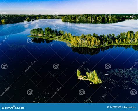 Aerial View Of Blue Lakes And Green Forests On A Sunny Summer Day In