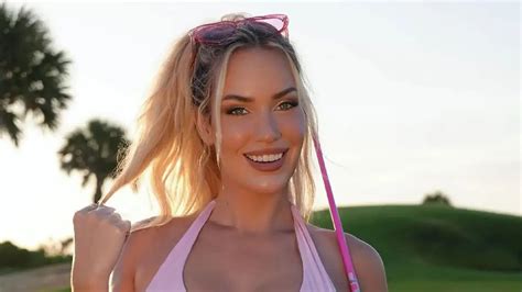 Paige Spiranac Wore A Tight Purple Top Showing Off Her Cleavage With Her Hair Wildly Flowing In