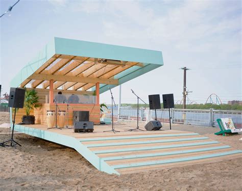 An Outdoor Stage Set Up On The Beach