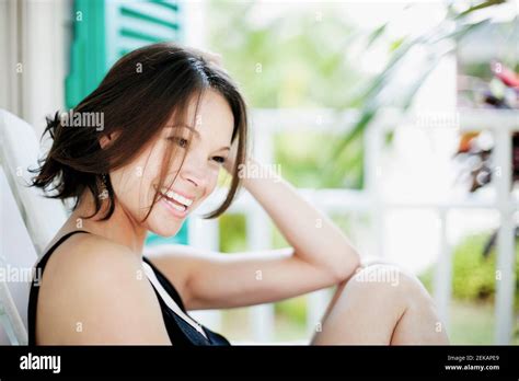 Woman Resting In A Deck Chair Stock Photo Alamy