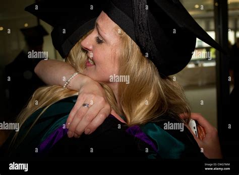 Edge Hill University Two Female Graduates Posing For Photographs Stock