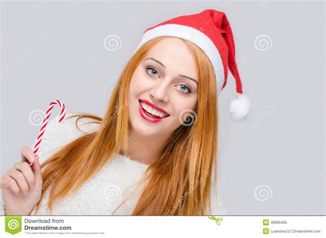 Girl With Santa Hat Smiling Holding A Candy Cane Stock Image Image Of Model Merry 48065455