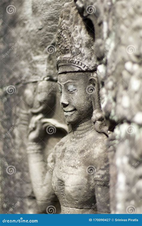 Apsara Surrounded By Intricate Stone Carving In Angkor Wat Temple