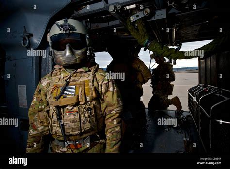 An Aerial Gunner With The Us Air Force 66th Rescue Squadron Stands All