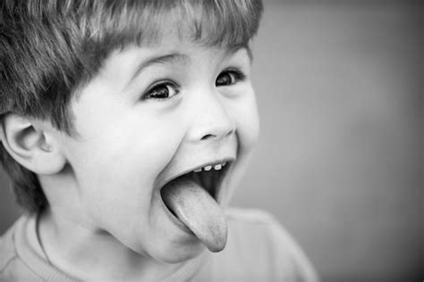 Premium Photo | Kids funny face close up portrait of a cute little child show tongue childhood ...