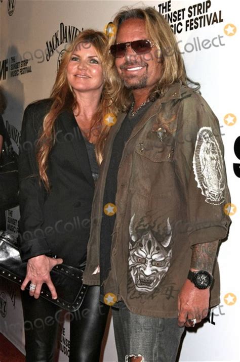 Photos And Pictures Vince Neil Holds Hands With A New Girlfriend As They Arrive At The 4th