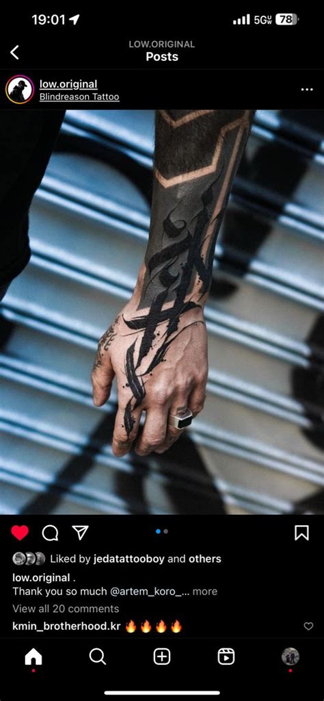 A Person With Tattoos On Their Arm And Hand