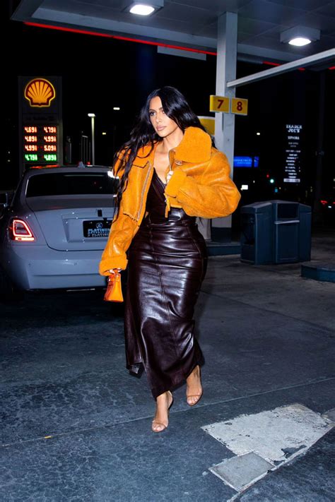 Kim Kardashian Wears Orange Yeezy Jacket Exiting Rolls Royce Pics Hollywood Life