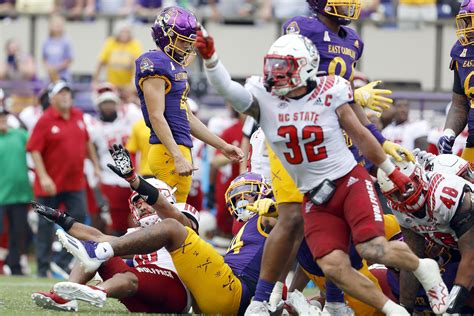 No. 13 NC State hangs on to win at ECU after missed kicks | AP News